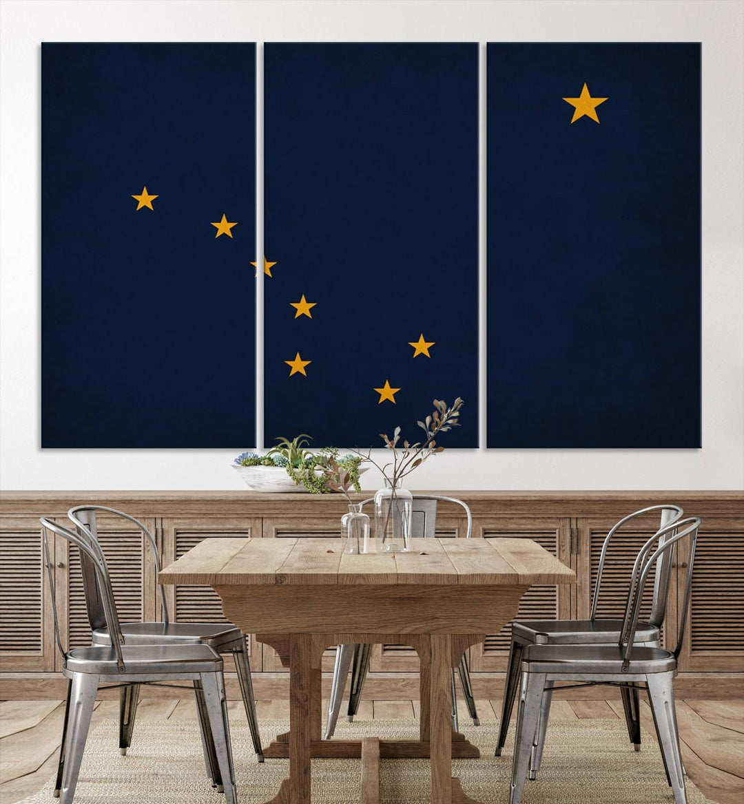 A contemporary living room featuring a triptych artwork of stars on a navy background, accentuated by the striking Alaska States Flag Wall Art Canvas Print.