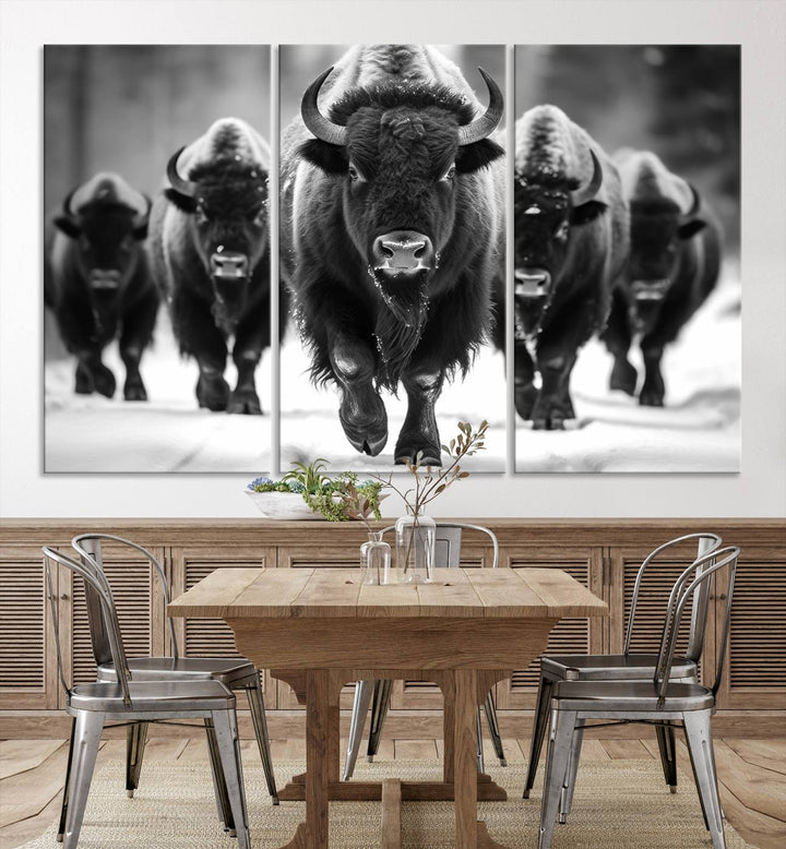 A modern living room features a striking black-and-white American Bison Art | Buffalo Herd Wall Art Canvas Print on the wall.