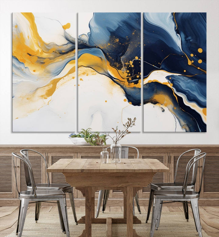 The Blue and Gold Abstract Fluid Canvas Art, with its swirling patterns, adorns the wall. This modern wall art beautifully complements the contemporary interior decor, adding an elegant touch with its rich blue, gold, and white tones.