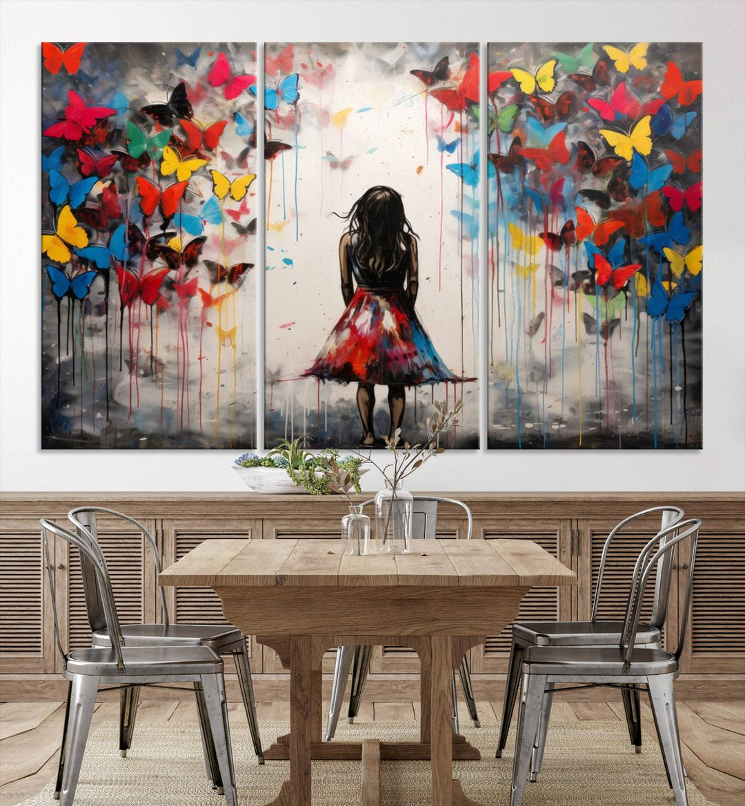 The Girl Butterfly Graffiti Abstract Canvas Print, featuring a vibrant depiction of a girl surrounded by butterflies on museum-quality canvas, is displayed prominently.