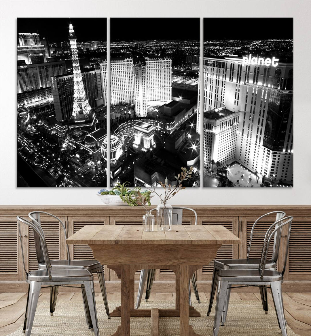 The Las Vegas Wall Art Canvas Print is a black and white triptych that showcases a city skyline at night. Crafted on museum-quality canvas with a UV-protective coating, it serves as an elegant and ready-to-hang focal point in the room.