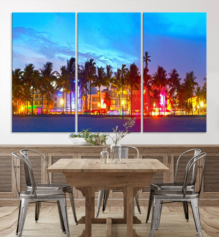 The living room features a three-panel Miami City Wall Art Canvas Print, showcasing a colorful, illuminated beach scene with palm trees on museum-quality canvas.