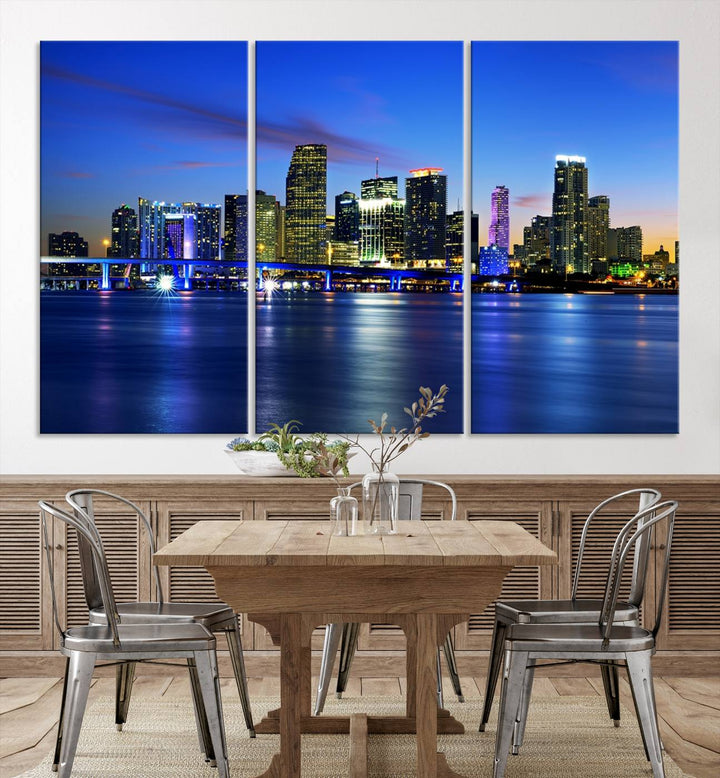 The modern living room showcases a striking Miami Blue Night Wall Art canvas print on the wall. The artwork is gallery wrapped on museum-quality canvas, ensuring durability and elegance.