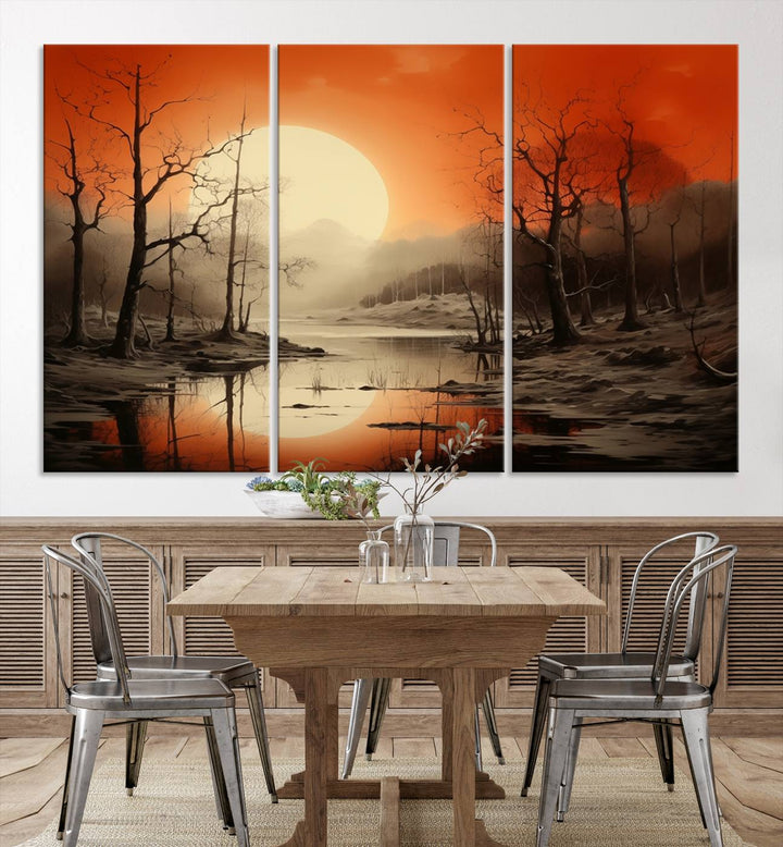 The "Abstract Watercolor Trees and Sunset on Lake Wall Art" is a triptych masterpiece, showcasing an orange-hued landscape of barren trees and a large sun. Displayed on museum-quality canvases with UV-protective coating, it creates a striking visual element in any space.