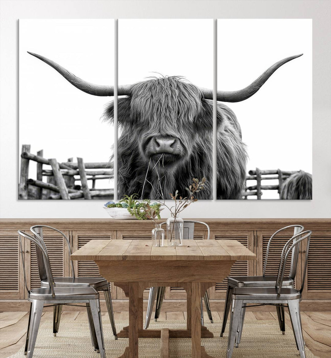 The Longhorn Canvas Print, featuring a black-and-white triptych of a Bighorn cow with shaggy fur and impressive long horns, is elegantly showcased. This wall art piece boasts a gallery-quality finish on premium canvas, bringing sophistication to any room.