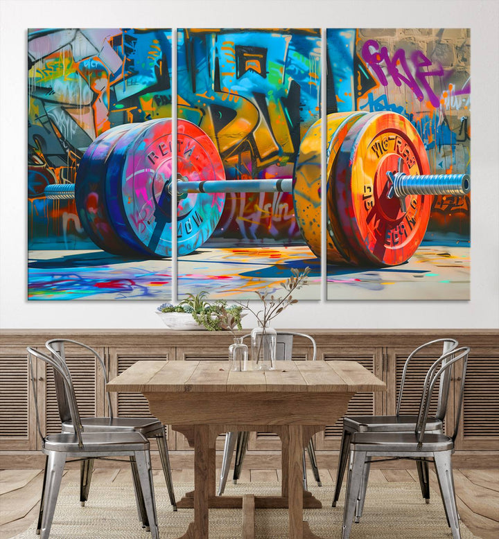 The Fitness Gym Barbell Graffiti Wall Art Canvas Print, a vibrant triptych featuring a barbell against a graffiti backdrop, elegantly hangs in the room. Crafted on premium canvas with a gallery-quality finish, this stunning piece of wall art effortlessly combines urban flair with sophisticated decor.