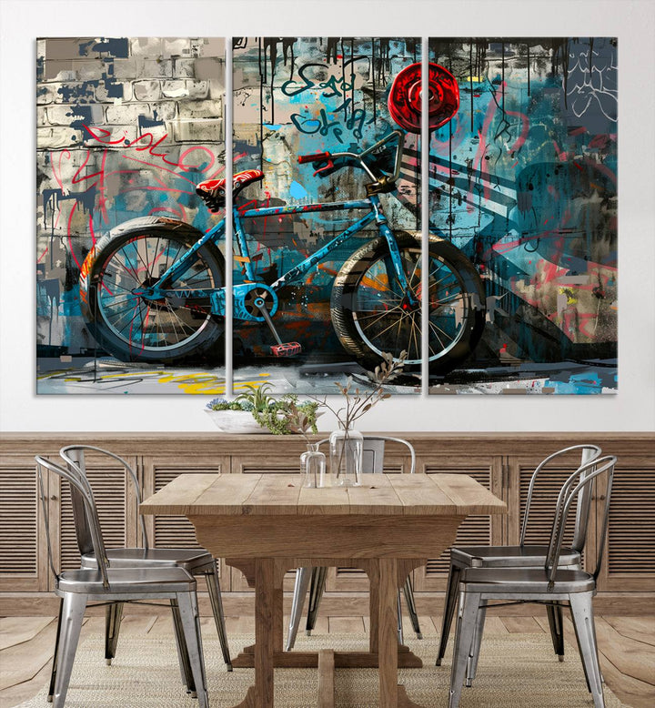 A modern living room features a triptych wall art of an abstract bicycle, designed in a graffiti style on a brick wall. This piece is expertly crafted on the Abstract Bicycle Wall Art Canvas Print, offering a premium canvas that ensures a gallery-quality finish.