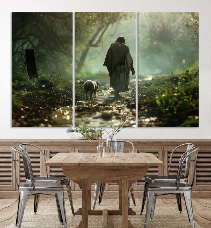 The wall art piece, titled "Jesus Shepherd a Lost Lamb Canvas Wall Art Print," is suspended on the wall and depicts a robed figure and a lamb wandering along a forest path.