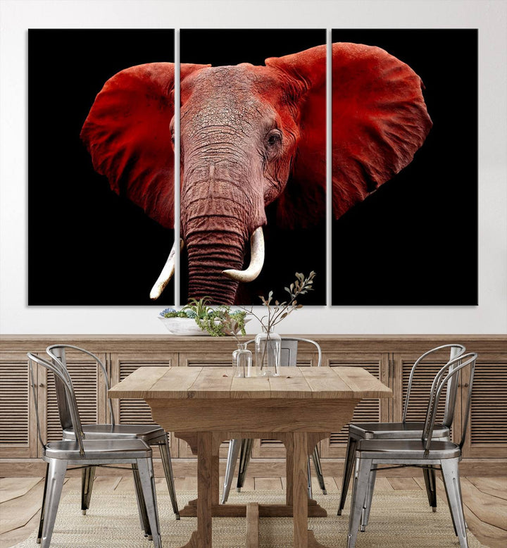 A Wall Art Canvas Print in the modern living room features a three-panel premium design of a red elephant face.