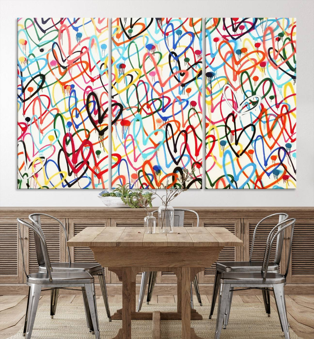 The Colorful Graffiti Love Canvas Print, a street art masterpiece with vibrant abstract swirls and a gallery-quality finish, hangs prominently on the wall.