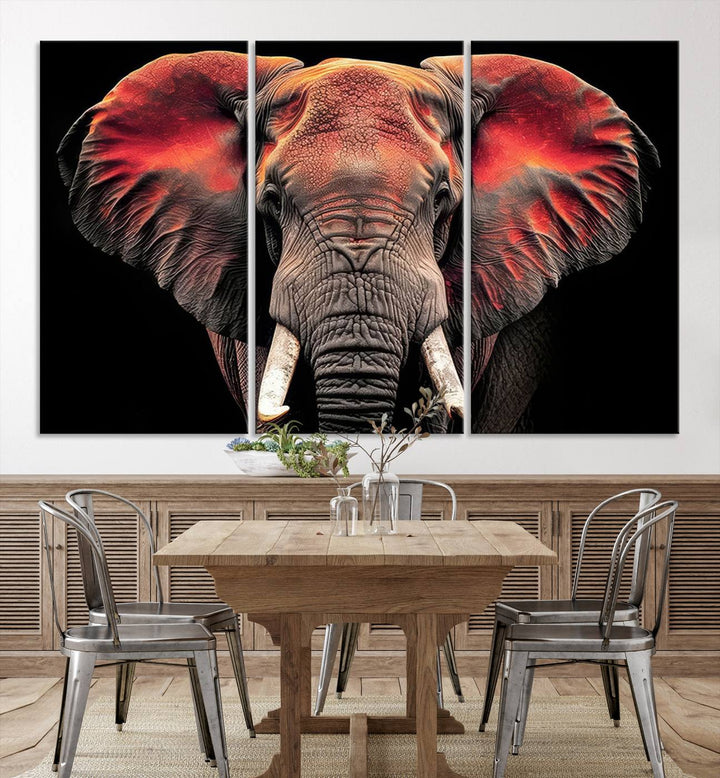 The Elephant Wall Art Canvas Print, featuring vibrant red and black tones, is a stunning artwork printed on museum-quality canvas. It comes with a UV-protective coating.