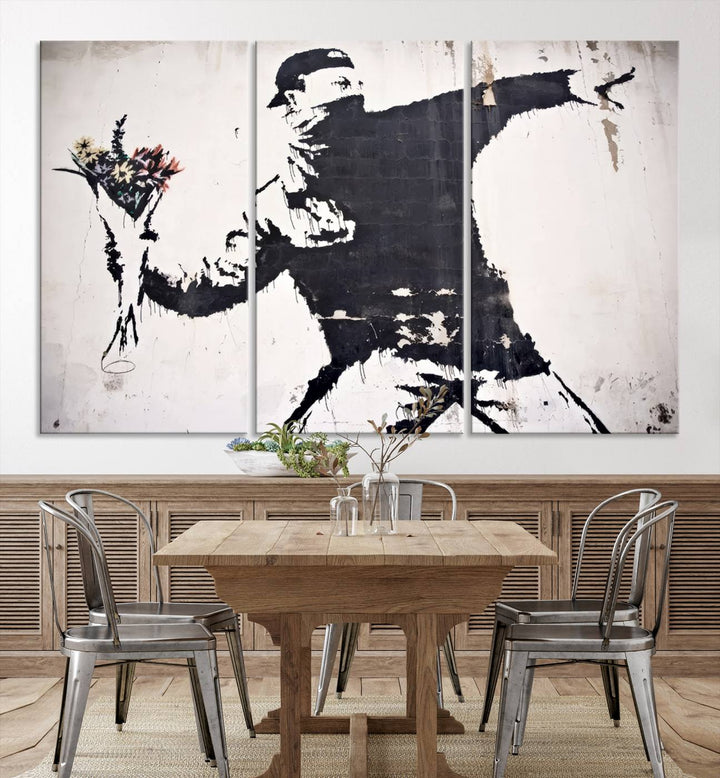 The living room features a split-panel art piece named "Banksy Flower Throw Graffiti Street Wall Art Canvas Print," gallery wrapped on museum-quality polycotton canvas and accentuated by modern decor elements.