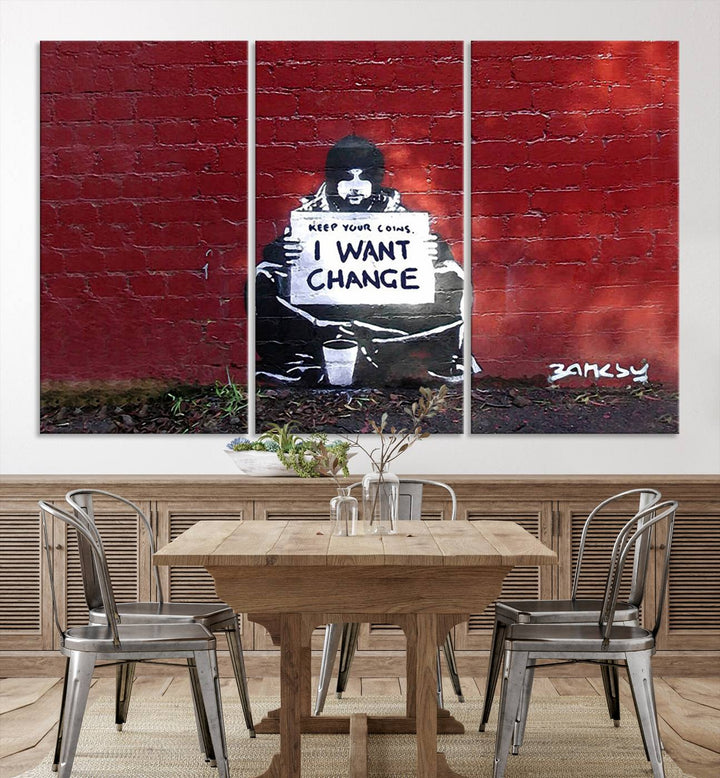 The living room showcases a triptych of stencil artwork on museum-quality canvas, featuring the Banksy I Want Change Graffiti Abstract Wall Art Canvas Print. This captivating piece depicts a person holding a sign that says "I want change" and is finished with a UV-protective coating to ensure long-lasting beauty.