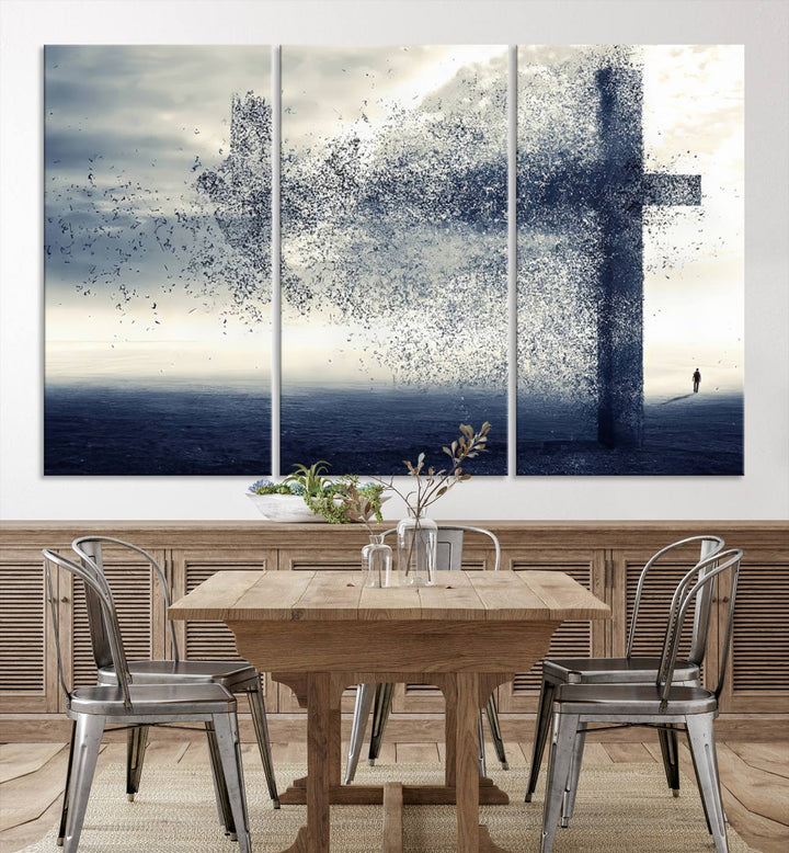 The "Jesus and the Fading Cross – Symbol of Faith" framed canvas print beautifully depicts a cross formed by birds against a moody sky above an ocean. This piece of Christian wall art infuses spirituality into the minimalist space.