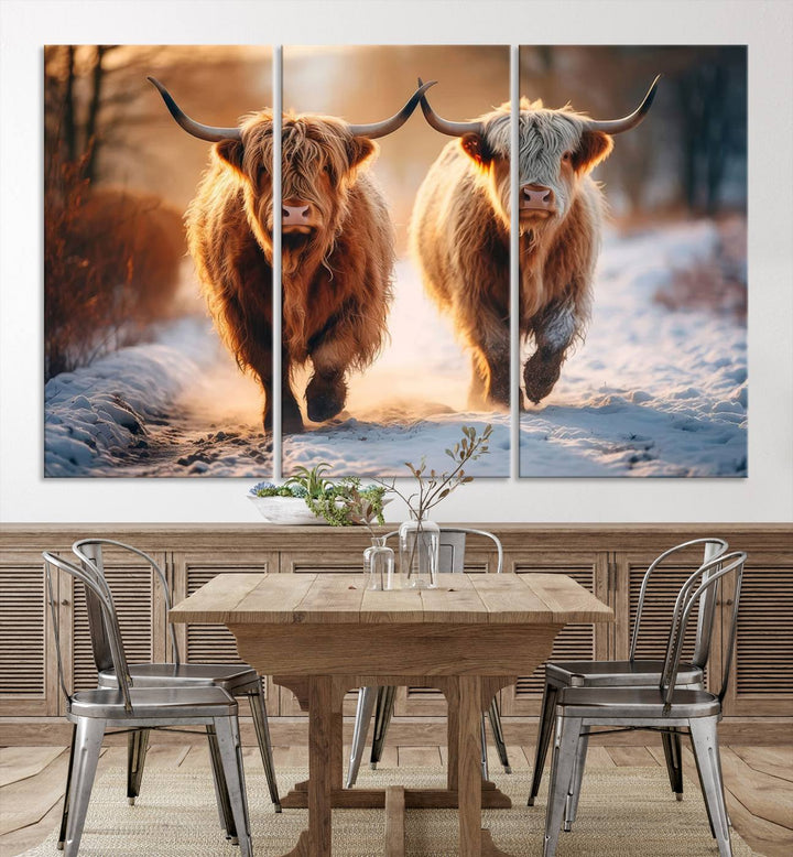 The living room showcases a triptych from the Scottish Highland Cow Horn Farm Wall Art Canvas Print collection, depicting two Highland cows running in the snow. Complementing this are handmade wall art pieces with a gallery-quality finish that add an elegant touch.