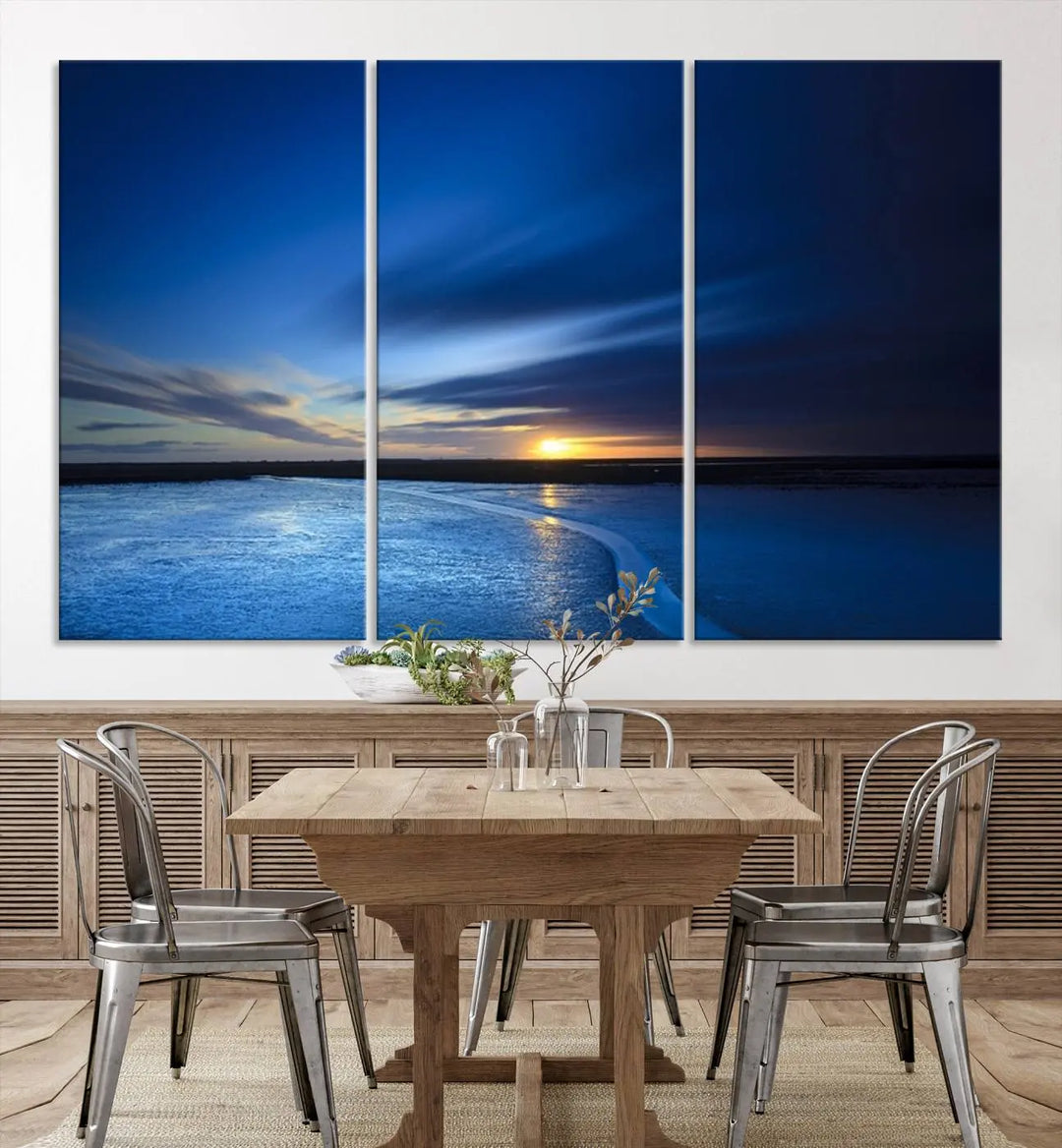 The living room features a triptych of the Wall Art Canvas Print Navy Sunset Lake Landscape Artwork, adding to its tranquil vibe.