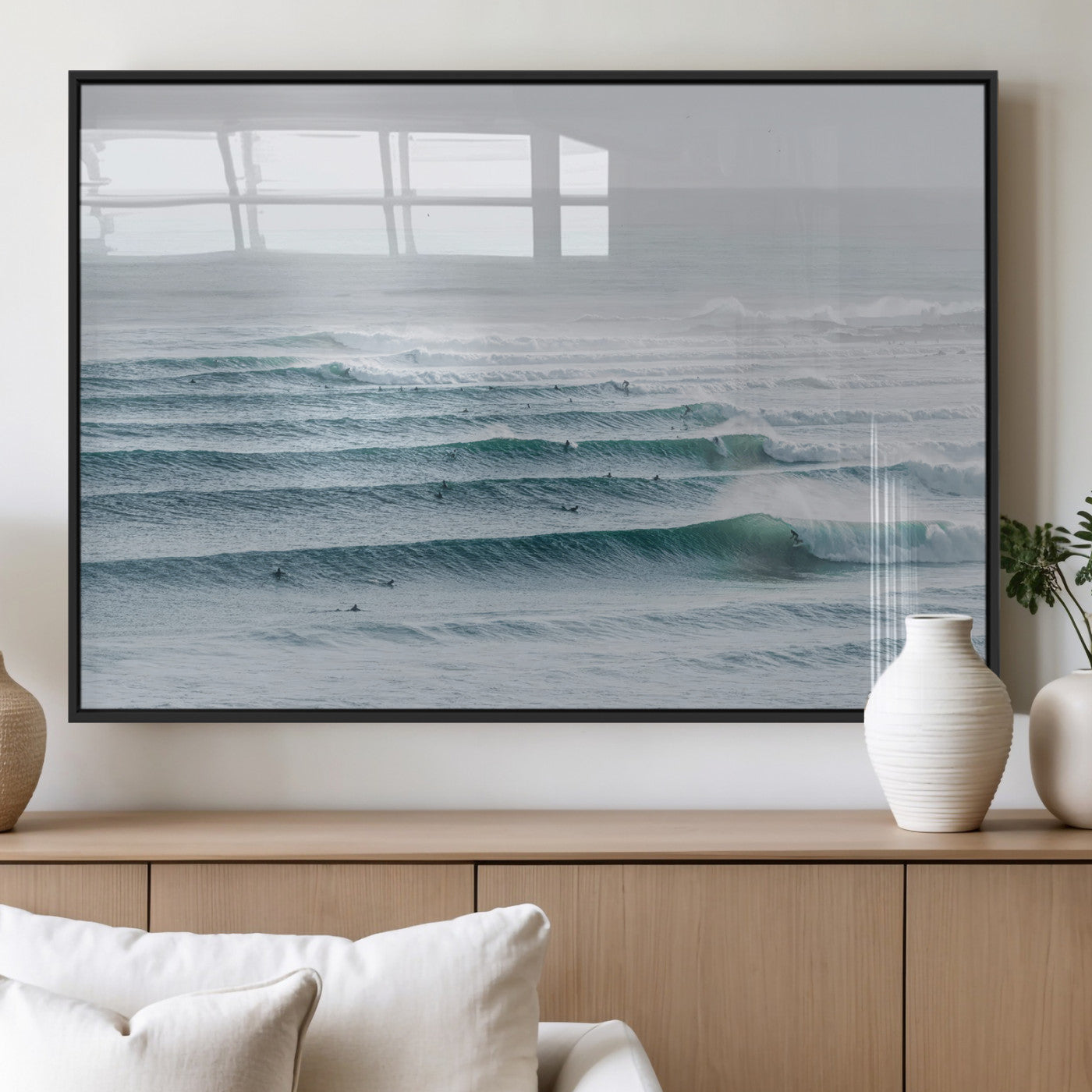 High-angle view of surfers lining up across layered ocean waves, ideal for minimal coastal or surf-inspired room decor.
