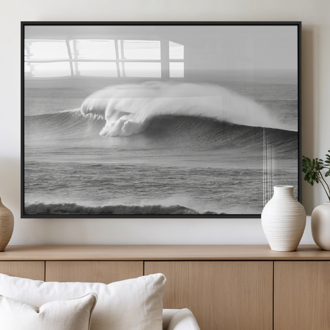 A dramatic black and white ocean wave crashing with immense force, capturing the raw power and movement of the sea in a bold seascape.