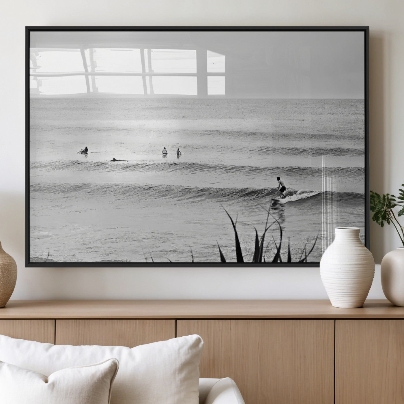 Monochrome canvas of surfers on calm ocean waves, ideal for minimalist coastal or beach-inspired interior decor.
