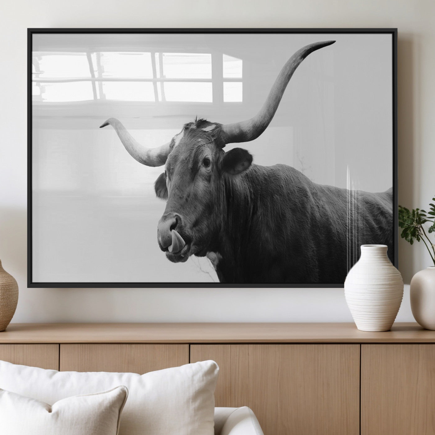 Black and white photo of a Texas Longhorn cow with curved horns, ideal for rustic, western or minimalist style home decor.