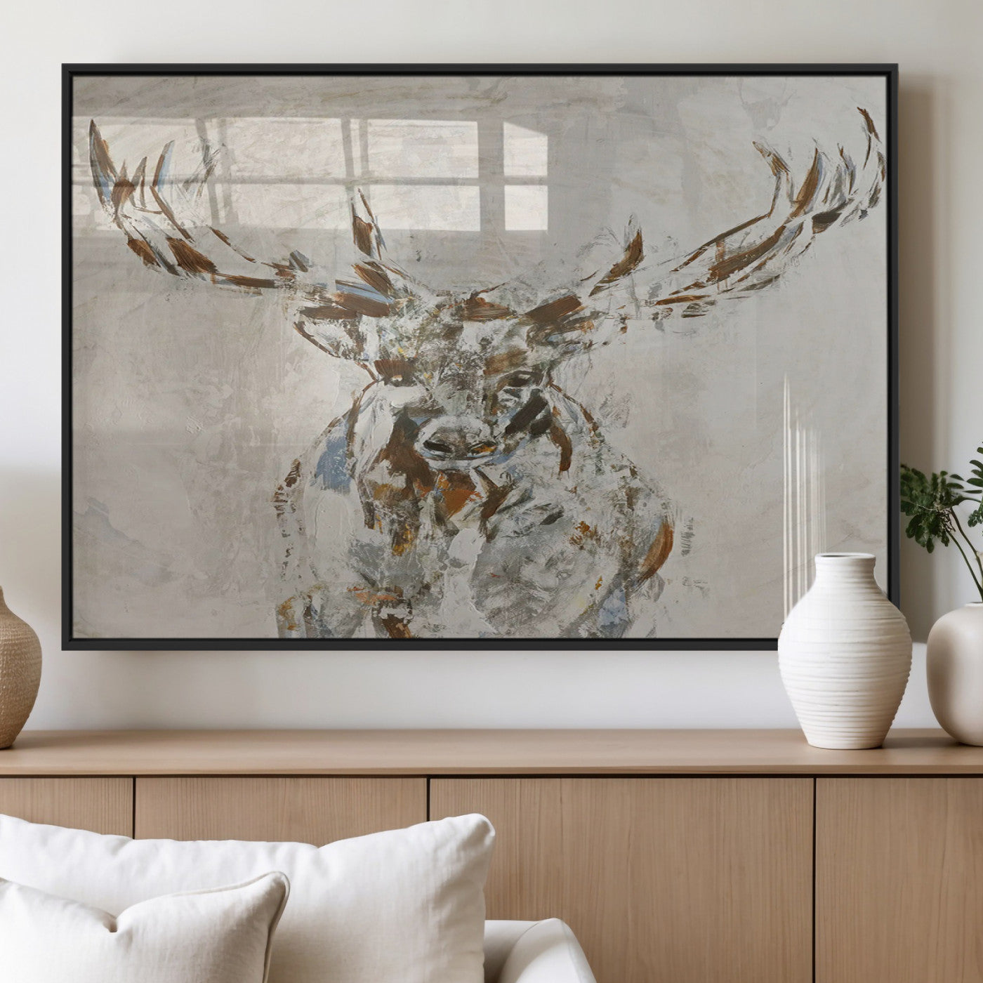 Abstract painting of a deer with antlers in neutral earth tones, ideal for modern rustic or lodge-style living room wall decor.