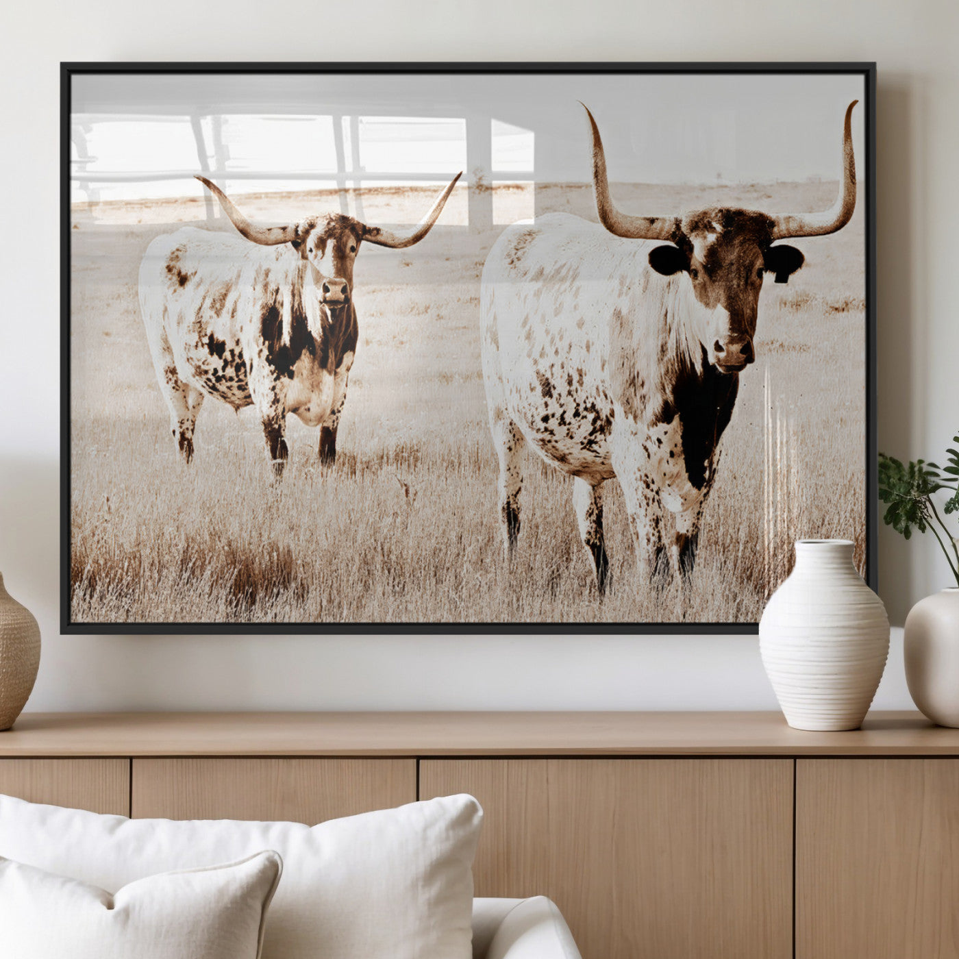 Two Texas longhorn cows standing in a sepia-toned pasture, evoking rustic charm perfect for farmhouse or western country interiors. (