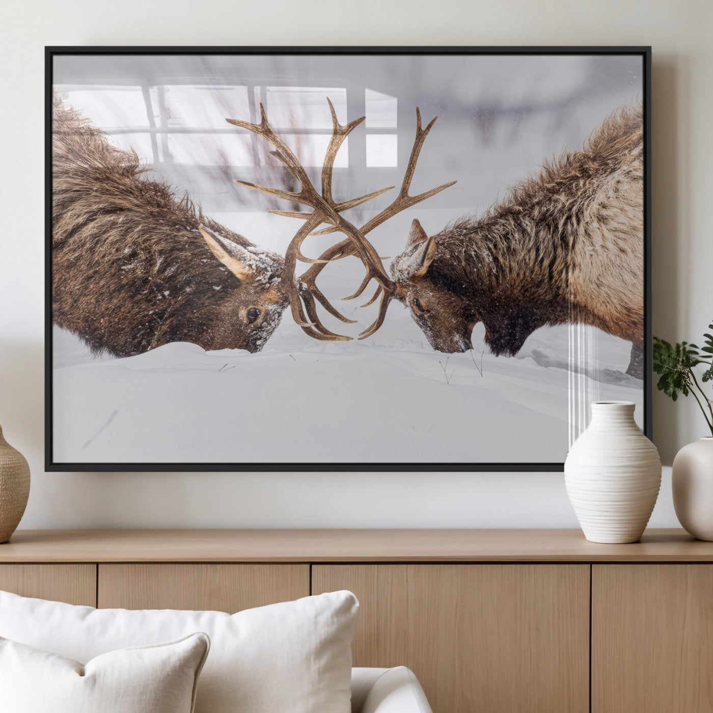 Two elk clashing antlers in a snowy forest, capturing raw power and wild energy, ideal for rustic cabin or lodge-style decor.