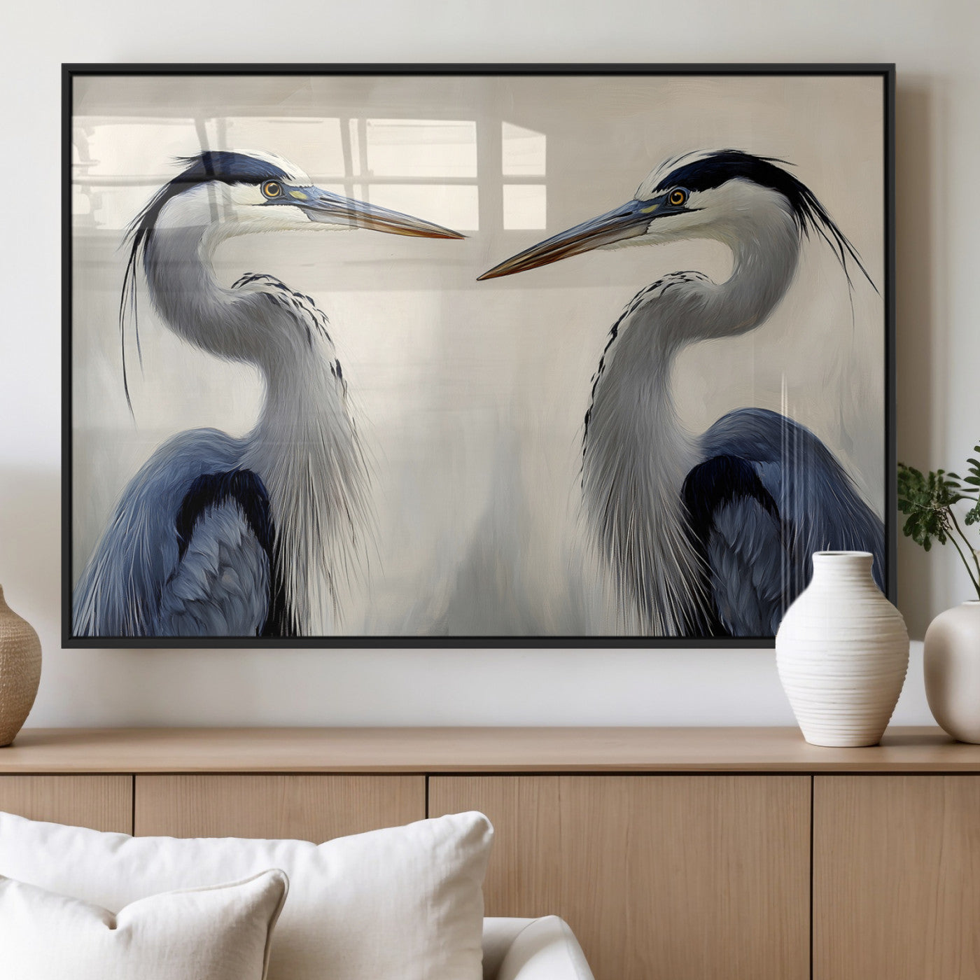 Two blue herons facing each other on a soft neutral background, ideal for coastal, tranquil, or nature-inspired minimalist interiors.