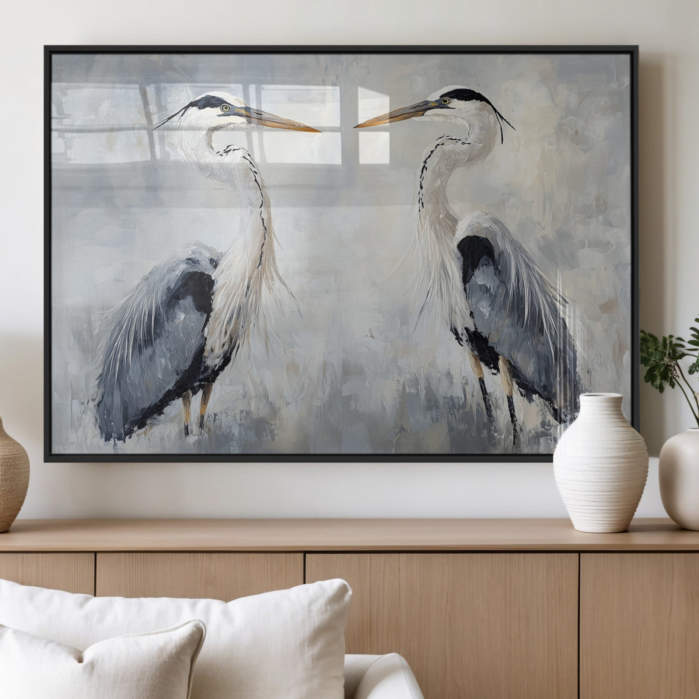 Two herons facing each other on a soft-toned background with blue-grey feathers, perfect for tranquil, coastal or nature-themed interiors.