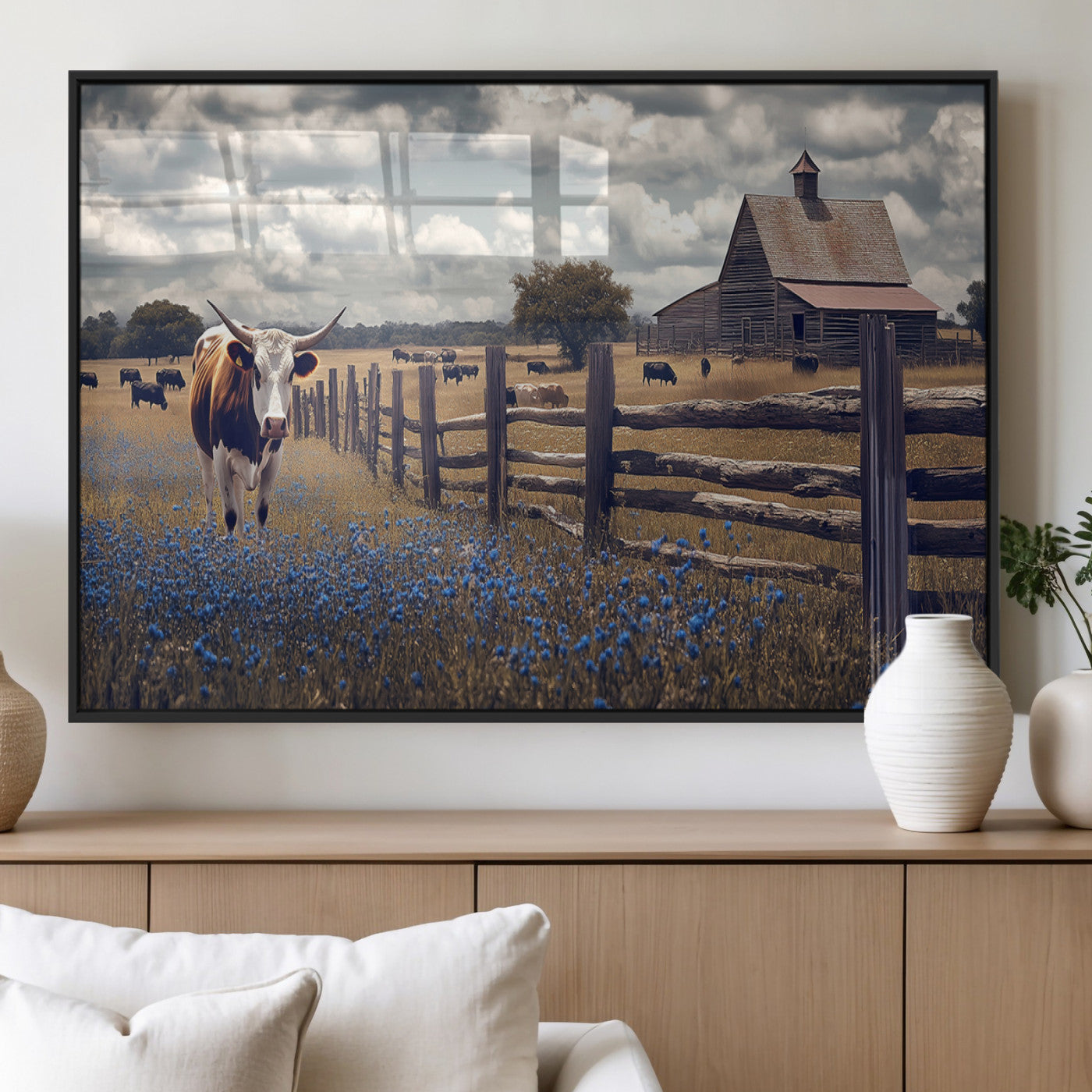 Framed canvas print of a Texas Longhorn near a rustic barn and fence, ideal for farmhouse or western-style home wall decor.
