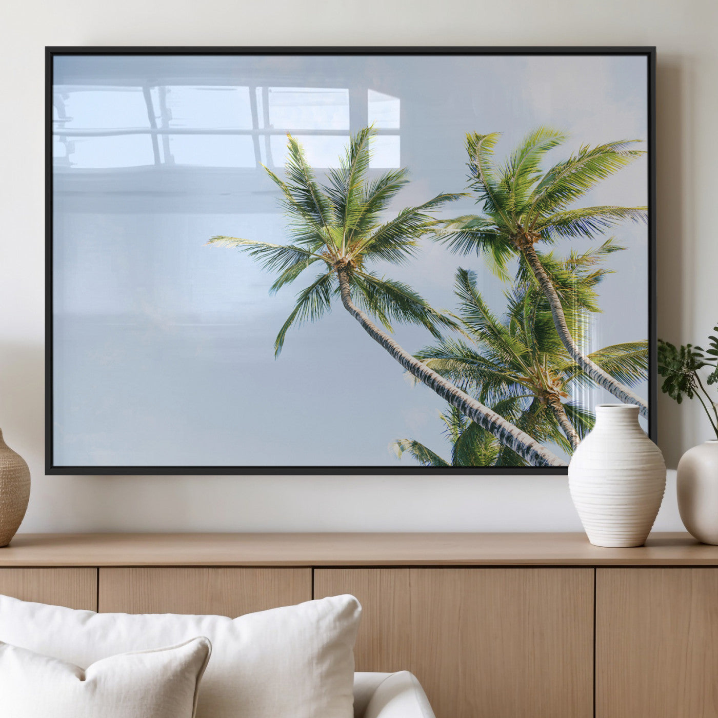 Tall palm trees swaying under a bright blue sky, capturing a tropical and minimalist beach vibe, perfect for coastal-inspired wall art.