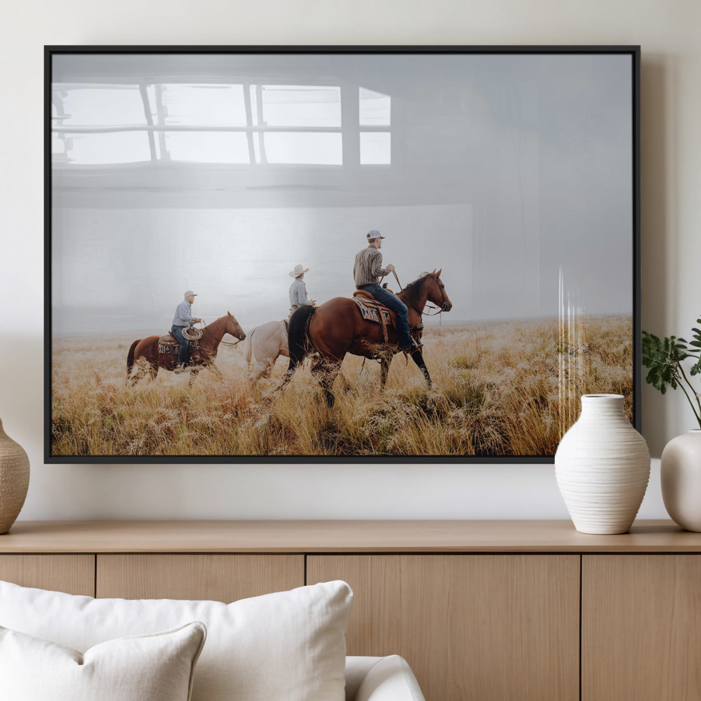 Three cowboys riding horses through a foggy prairie landscape, dressed in Western attire, evoking a rustic and adventurous Wild West aesthetic.