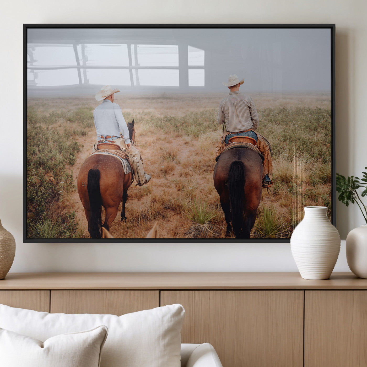 Two cowboys riding horseback through a misty prairie, capturing the rustic and adventurous spirit of the Western frontier.