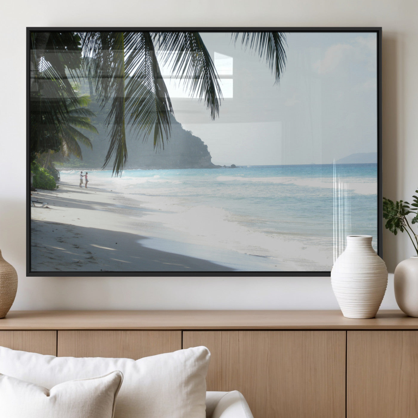 Tropical beach with palm tree shadows, white sand, and turquoise ocean waves, creating a serene and relaxing island escape atmosphere.