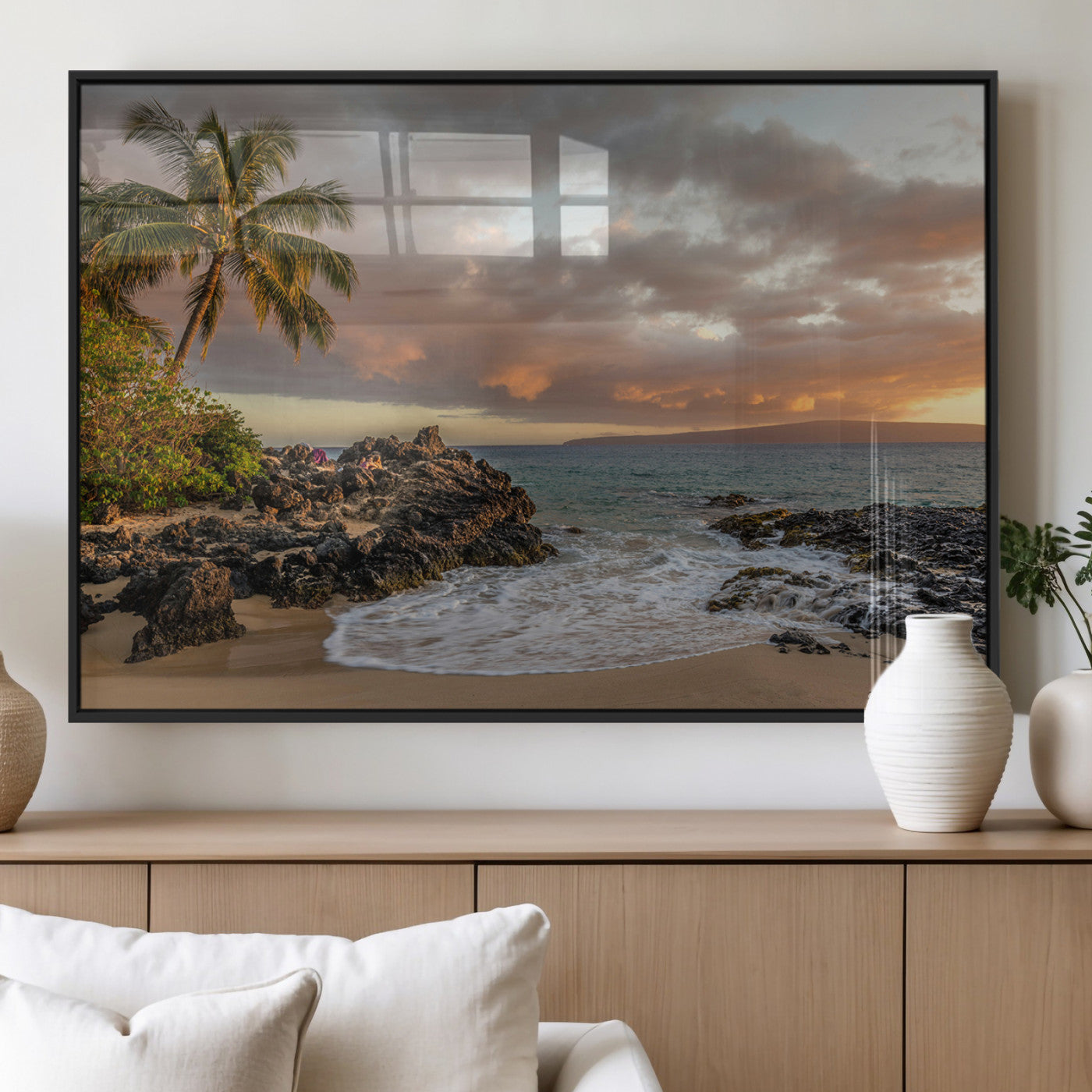 Golden sunset over a tropical beach with palm trees, rocky shoreline, and gentle ocean waves, perfect for coastal and island-inspired decor.