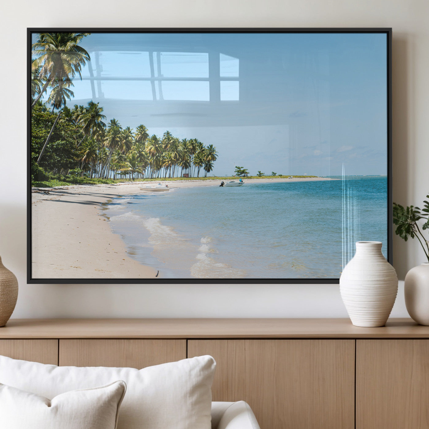 A serene tropical beach with clear blue water, soft sand, and lush palm trees under a bright sky, creating a peaceful island paradise atmosphere.