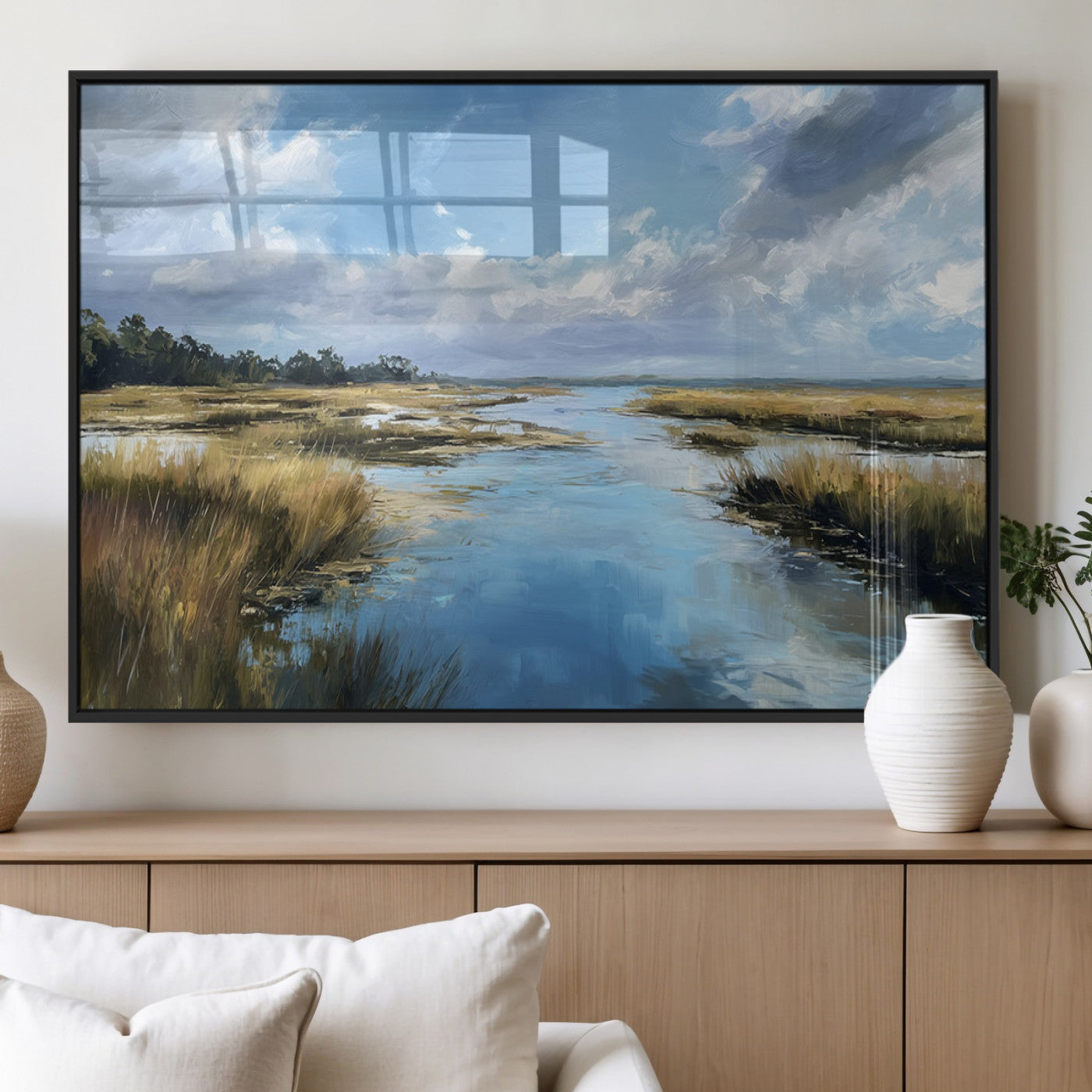 A beautiful, painterly landscape of a calm river winding through a marsh, with vibrant green grasses and a bright blue sky filled with fluffy clouds.