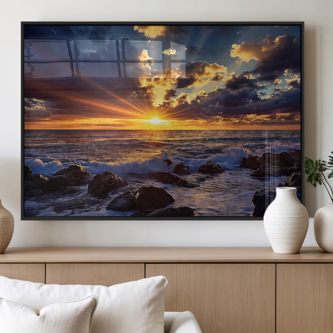 An explosive sunset over the ocean with dramatic clouds and rays of sunlight reflecting off the water, creating a vibrant and captivating view.