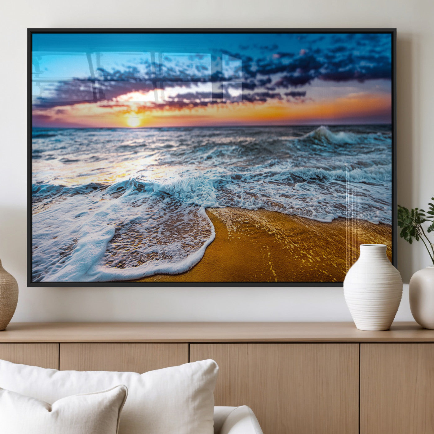 Beautiful ocean shoreline at sunset with foamy waves washing onto golden sand under a colorful sky – Wall Art Canvas Print.