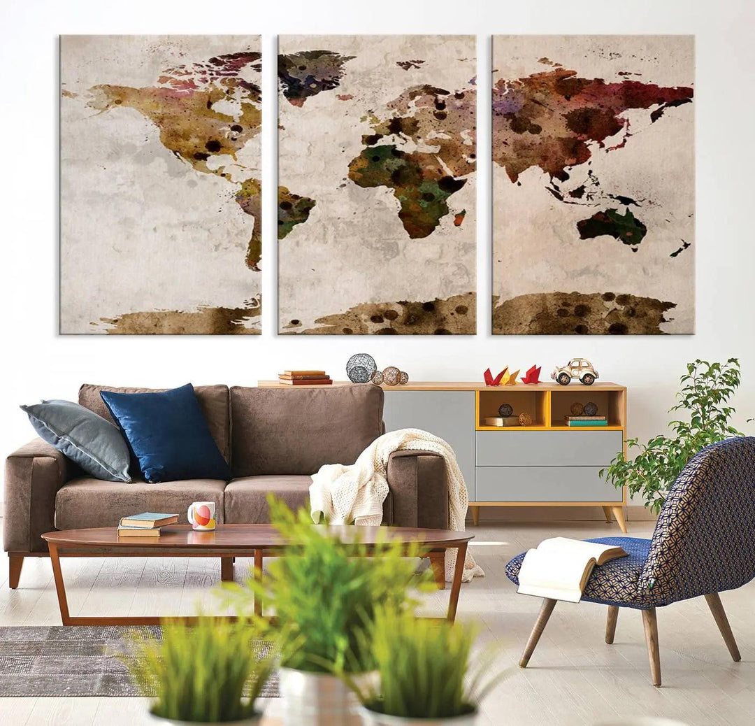 A Watercolor World Map Canvas Print, wrapped in an elegant gallery style, hangs on the wall.