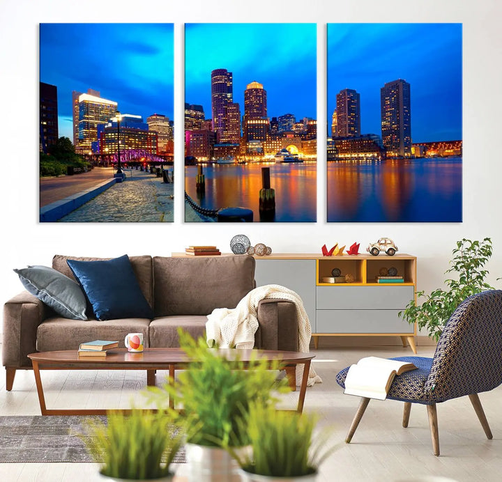 A triptych of the "Boston City Lights Night Blue Skyline Cityscape View Wall Art Canvas Print" adorns the wall. This museum-quality canvas artwork is ready to hang and includes a UV-protective coating for lasting brilliance.