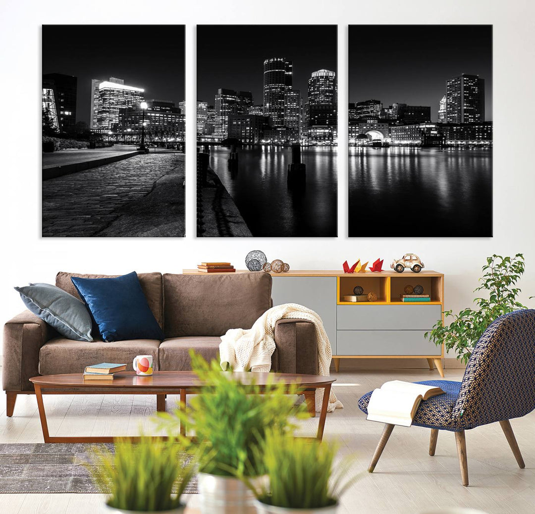 The Boston Lights Skyline Black and White Wall Art Cityscape Canvas Print, crafted with museum-quality canvas and UV-protective coating, serves as a striking triptych centerpiece in the living room.