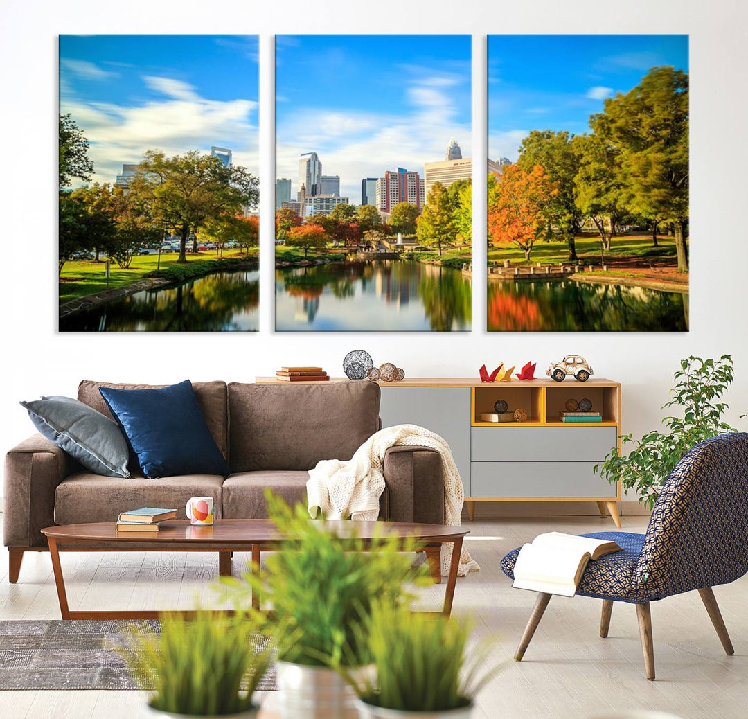 The Charlotte City Park at Spring Skyline Cityscape View wall art canvas print is a triptych featuring a scenic park with a lake and city skyline. It is gallery-wrapped on museum-quality canvases.