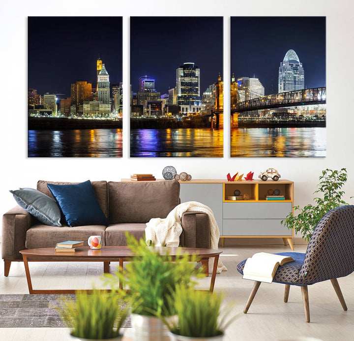 The Cincinnati City Lights Night Skyline Cityscape View Wall Art Canvas Print, crafted on museum-quality canvas with UV-protective coating and ready to hang, adds a touch of sophistication to the wall.