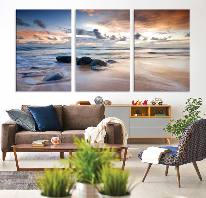 The "Serene Weather On The Beach Wall Art Canvas Print," featuring a tranquil beach scene with rocks and waves, is ready to hang and enjoy.