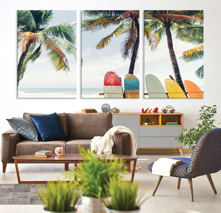 The room showcases The Palm and Surfing Board Wall Art Canvas Print, a triptych of palm trees and surfboards by the beach, elegantly gallery wrapped for a sophisticated finish.