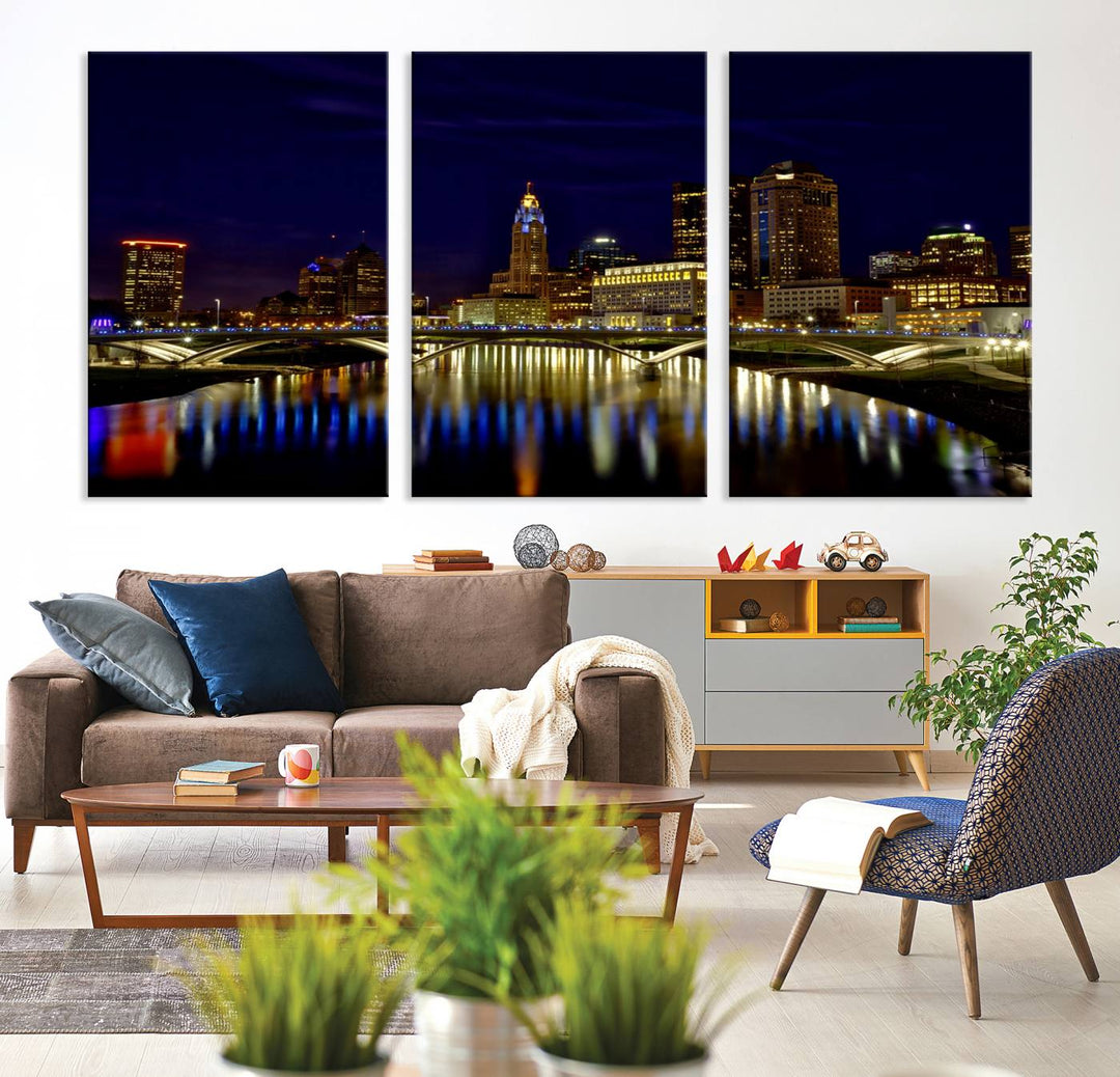 The "Columbus City Lights Night Skyline Cityscape View Wall Art Canvas Print" showcases a stunning city skyline at night, with illuminated buildings and bridges reflecting in the river, on a museum-quality canvas ready to hang.