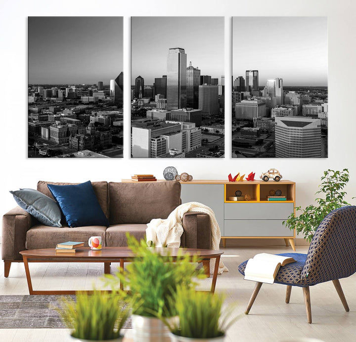 A modern living room showcases the Dallas City Lights Skyline Black and White Wall Art Cityscape Canvas Print. This gallery-wrapped piece offers a sleek finish and is crafted from museum-quality pollycotton. It features a UV-protective coating to ensure lasting vibrancy.