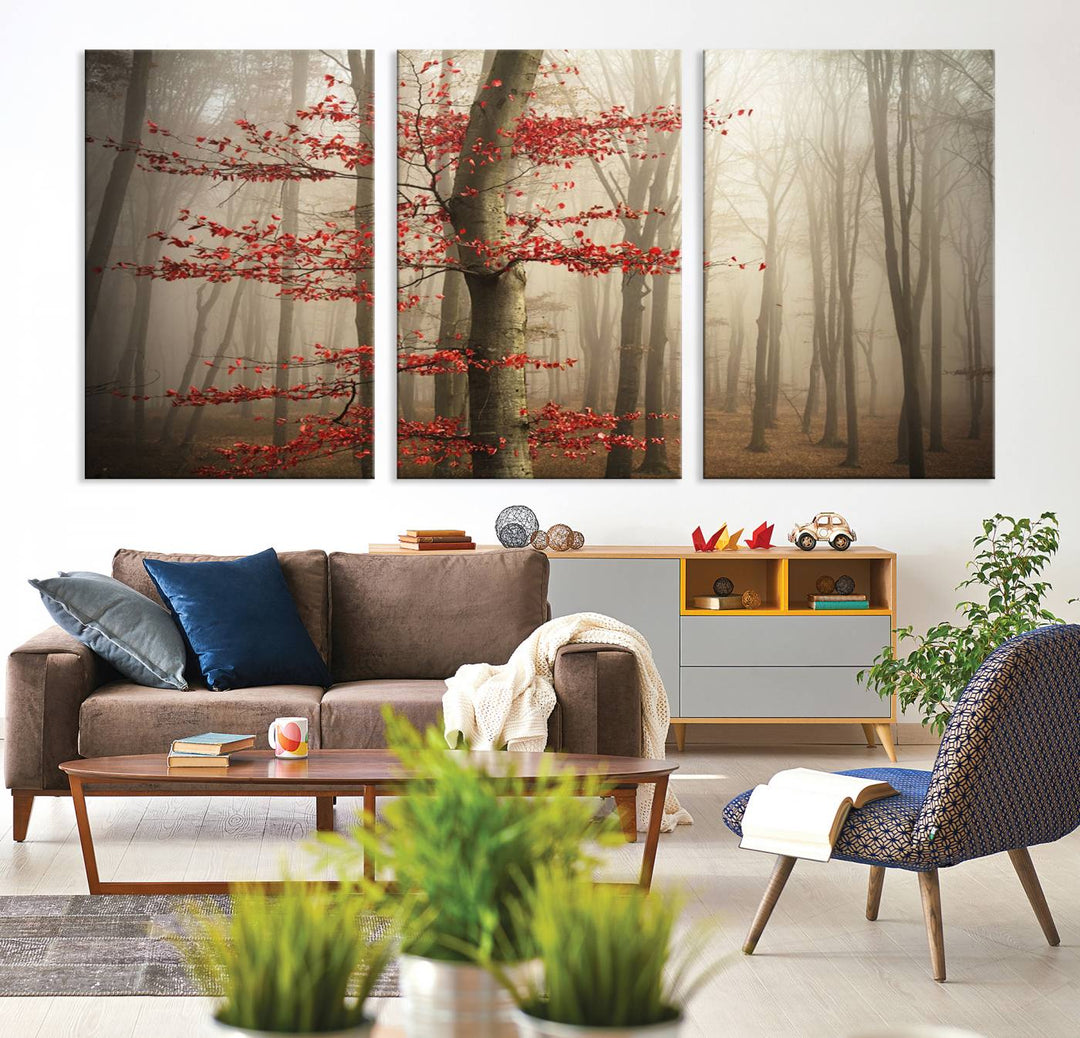 The living room features the Foggy Forest Wall Art, an Autumn Trees Canvas Print that showcases a serene nature scene with foggy woodland decor and a tree adorned in vibrant red leaves.