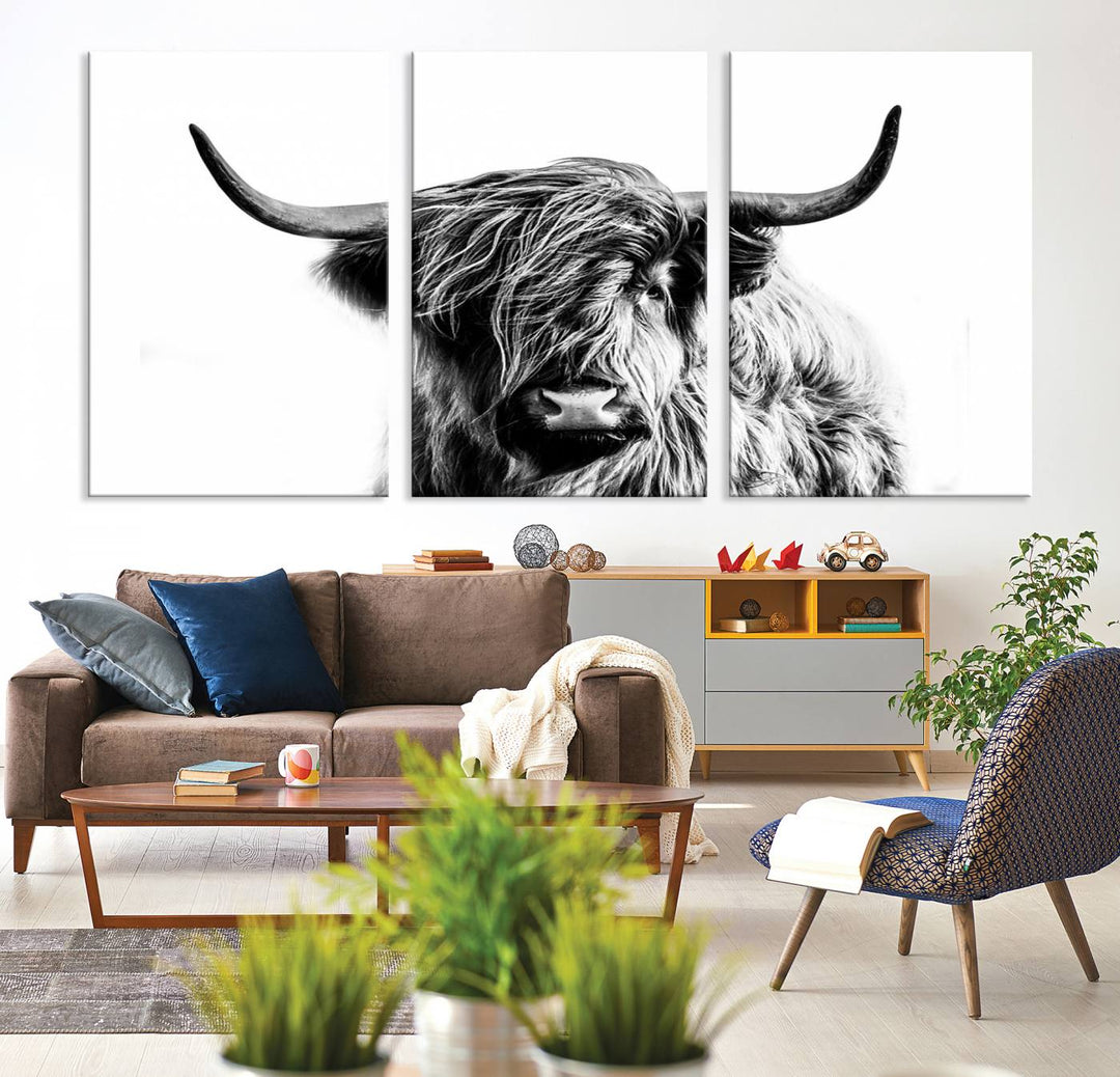 The Scottish Highland Cow Cattle Art Print Farmhouse Wall Art Canvas Print enhances rustic farmhouse decor with its depiction of a long-haired, large-horned cow. This triptych is an ideal choice for chic wall art.